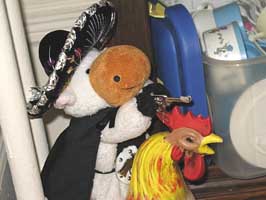 stuffed cow riding chicken